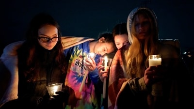 Mourners hold a candlelight vigil for Alexandria Verner at the Clawson High School football field in Clawson, Michigan, Tuesday, Feb. 14, 2023. (AP) Mourners hold a candlelight vigil for Alexandria Verner at the Clawson High School football field in Clawson, Michigan, Tuesday, Feb. 14, 2023. (AP)