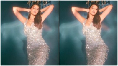 Nora looked just too glam in a silver slip short dress featuring silver feather-like embellishment and sequin details as she posed for the pictures. (Instagram/@norafatehi) Nora looked just too glam in a silver slip short dress featuring silver feather-like embellishment and sequin details as she posed for the pictures. (Instagram/@norafatehi)