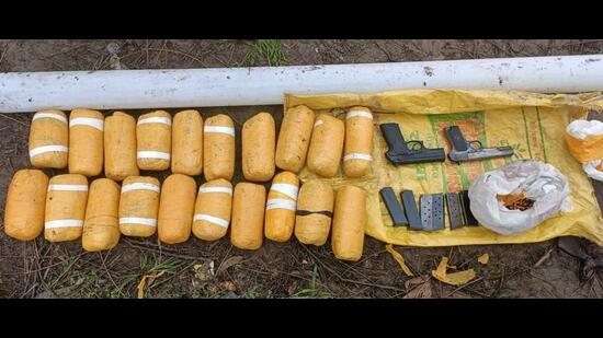 The Border Security Force (BSF) recovered 20 packets of heroin, two foreign-made pistols and ammunition after firing at smugglers spotted across the barbed wire fence near Khasawali village of Gurdaspur district early on Saturday. (HT Photo)