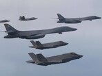 U.S. Air Force B-1B bombers, center, F-22 fighter jets and South Korean Air Force F-35 fighter jets, bottom, fly over South Korea Peninsula during a joint air drill in South Korea, U.S. Air Force B-1B bombers, center, F-22 fighter jets and South Korean Air Force F-35 fighter jets, bottom, fly over South Korea Peninsula during a joint air drill in South Korea,