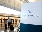 FILE PHOTO: A passenger walks to the First Class counter of Cathay Pacific Airways at Hong Kong Airport in Hong Kong, China April 4, 2018.      REUTERS/Bobby Yip/File Photo