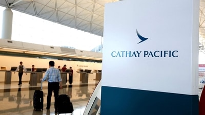 FILE PHOTO: A passenger walks to the First Class counter of Cathay Pacific Airways at Hong Kong Airport in Hong Kong, China April 4, 2018.      REUTERS/Bobby Yip/File Photo (REUTERS)
