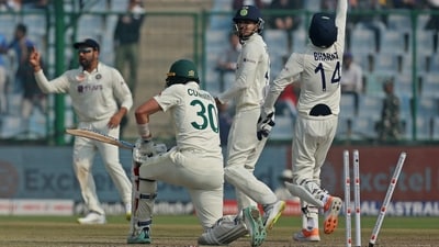 Australia's Pat Cummins is bowled out by India's Ravindra Jadeja. (REUTERS)