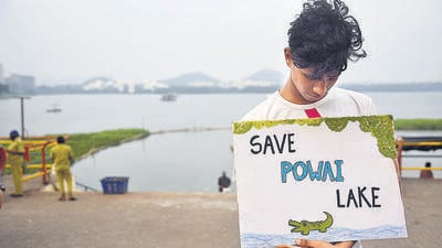 Mumbai, India - October 17, 2021: People stage a peaceful protest against BMC's illegal cycle track project inside the Powai Lake at Visarjan Point, Powai, in Mumbai, India, on Sunday, October 17, 2021. (Photo by Vijay Bate/HT Photo) (HT PHOTO) Mumbai, India - October 17, 2021: People stage a peaceful protest against BMC's illegal cycle track project inside the Powai Lake at Visarjan Point, Powai, in Mumbai, India, on Sunday, October 17, 2021. (Photo by Vijay Bate/HT Photo) (HT PHOTO)