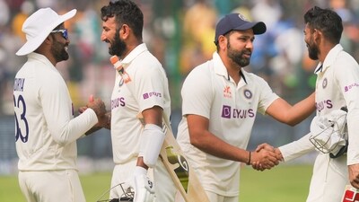 Indian captain Rohit Sharma greets teammates Cheteshwar Pujara and Srikar Bharat after the end of the 2nd test cricket match between India and Australia, at the Arun Jaitley Stadium (PTI) Indian captain Rohit Sharma greets teammates Cheteshwar Pujara and Srikar Bharat after the end of the 2nd test cricket match between India and Australia, at the Arun Jaitley Stadium (PTI)