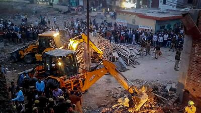 Rescue operation underway at Loni in Ghaziabad on Sunday. (PTI) Rescue operation underway at Loni in Ghaziabad on Sunday. (PTI)