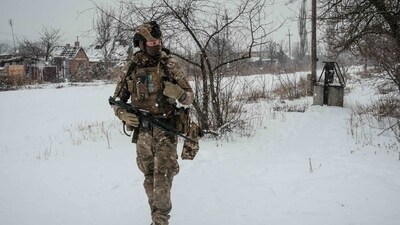 Russia-Ukraine War: A serviceman, call sign Virus, of the Ukrainian Armed Forces Vedmak (Witcher) unit patrols on the frontline near Bakhmut. (AFP)