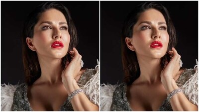 Styled by fashion stylist Hitendra Kapopara, Sunny wore her tresses open in dewy wet look and decked up in silver eyeshadow, black eyeliner, black kohl, mascara-laden eyelashes, drawn eyebrows, contoured cheeks and a shade of bright red lipstick. (Instagram/@sunnyleone) Styled by fashion stylist Hitendra Kapopara, Sunny wore her tresses open in dewy wet look and decked up in silver eyeshadow, black eyeliner, black kohl, mascara-laden eyelashes, drawn eyebrows, contoured cheeks and a shade of bright red lipstick. (Instagram/@sunnyleone)