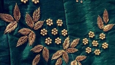 Zardosi: Zardosi is a form of embroidery that involves stitching metallic wires and beads onto fabrics to create intricate designs. It is commonly used in bridal wear and formal dresses. (Pinterest) Zardosi: Zardosi is a form of embroidery that involves stitching metallic wires and beads onto fabrics to create intricate designs. It is commonly used in bridal wear and formal dresses. (Pinterest)