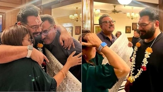 Kayoze Irani hugs his parents Boman Irani and Zenobia Irani.