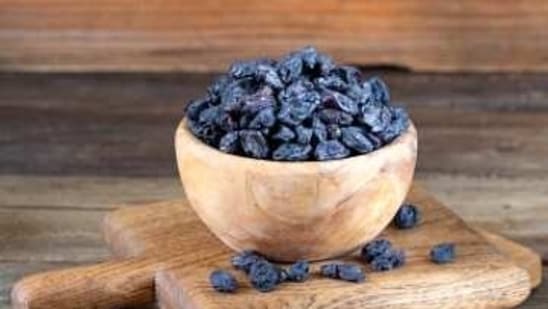 Black raisins help in boosting hair health, skin health and are a good source of iron.&nbsp;(Unsplash)