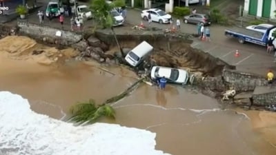 Brazil Rainfall: Vehicles fallen from an elevated area along the beach in Sao Sebastiao, east of Sao Paulo, Brazil. (AP) Brazil Rainfall: Vehicles fallen from an elevated area along the beach in Sao Sebastiao, east of Sao Paulo, Brazil. (AP)