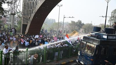 Police teams using water cannons to disperse the crowd of protesting government employees near the Panchkula-Chandigarh border. (Sant Arora/HT)