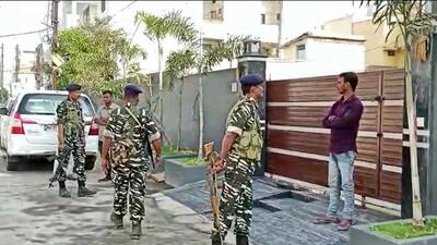 Security personnel outside the residence of a Congress leader during ED raid. (PTI) Security personnel outside the residence of a Congress leader during ED raid. (PTI)