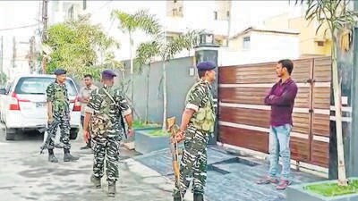 Security personnel outside the residence of a Congress leader during a raid by ED in Raipur on Monday. (PTI) Security personnel outside the residence of a Congress leader during a raid by ED in Raipur on Monday. (PTI)