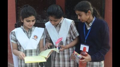 Students busy in discussion at an examination centre after appearing in their UP Board exams in Prayagraj on Monday. (HT) Students busy in discussion at an examination centre after appearing in their UP Board exams in Prayagraj on Monday. (HT)