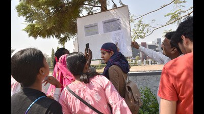 Students check seat arrangement at an exam centre in Pune on Monday, ahead of HSC exams. (HT PHOTO) Students check seat arrangement at an exam centre in Pune on Monday, ahead of HSC exams. (HT PHOTO)