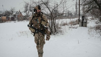 Russia-Ukraine War: A serviceman, call sign Virus, of the Ukrainian Armed Forces Vedmak (Witcher) unit patrols on the frontline near Bakhmut. (AFP)