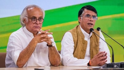 New Delhi: Congress leader Pawan Khera with party leader Jairam Ramesh addresses a press conference at AICC headquarters, in New Delhi, Monday. (PTI)