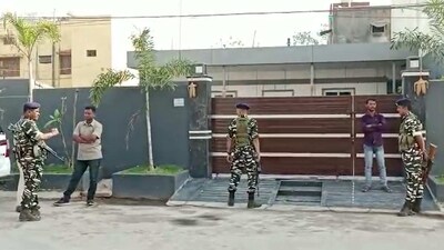 Security personnel outside the residence of a Congress leader during a raid by the Enforcement Directorate (ED) in connection with a mining case, in Raipur. (PTI)