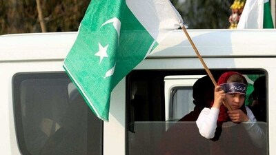 A girl holds a Pakistani flag during a rally. (Reuters File) A girl holds a Pakistani flag during a rally. (Reuters File)