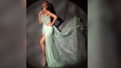 Jacqueline's stunning tea-green gown is made from the softest silk mousseline and features dramatic ruffle detailing on her shoulders, a boned bodice, a sensual cut-out under the bust and a slit that goes up to her thighs. (Instagram/@jacquelinef143) Jacqueline's stunning tea-green gown is made from the softest silk mousseline and features dramatic ruffle detailing on her shoulders, a boned bodice, a sensual cut-out under the bust and a slit that goes up to her thighs. (Instagram/@jacquelinef143)