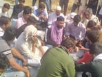 Families of Muslim men killed in Bhiwani sit in protest.