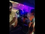 The image shows Shanky Chauhan fast asleep in the backseat of a three-wheeler. The image shows Shanky Chauhan fast asleep in the backseat of a three-wheeler.