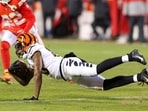 Tee Higgins #85 of the Cincinnati Bengals carries the ball against the Kansas City Chiefs.