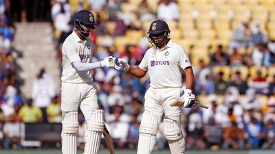 Indian skipper Rohit Sharma fist bumps KL Rahul during Day one of the 1st Test match between India and Australia (ANI )