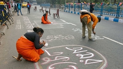 People paint the road on the eve of International Mother Language Day, in Kolkata on Monday. (ANI Photo)