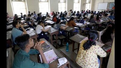 Class 12 exams began on Tuesday. Students seen writing the paper at SP College. (Rahul Raut/HT PHOTO) Class 12 exams began on Tuesday. Students seen writing the paper at SP College. (Rahul Raut/HT PHOTO)