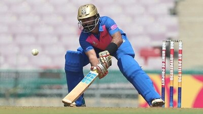 Dinesh Karthik, who turned up for the DY Patil Group B team, on way to an unbeaten 75 off 38 balls against RBI on Tuesday. Dinesh Karthik, who turned up for the DY Patil Group B team, on way to an unbeaten 75 off 38 balls against RBI on Tuesday.