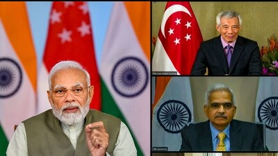 **EDS: SCREENSHOT VIA PIB** New Delhi: Prime Minister Narendra Modi and Singapore Prime Minister Lee Hsien Loong witness launch of  the launch of UPI-PayNow linkage (Real-time Payment Systems Linkage between the two countries) via video conferencing, Tuesday, Feb. 21, 2023. (PTI Photo)  (PTI02_21_2023_000054A) *** Local Caption *** (PTI)