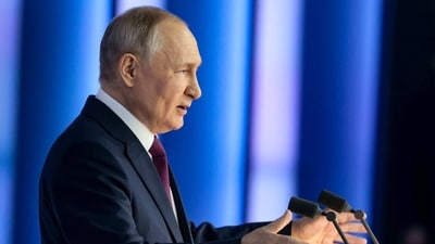 Russian President Vladimir Putin gestures as he gives his annual state-of-the-nation address in Moscow, Russia, Tuesday. (AP)
