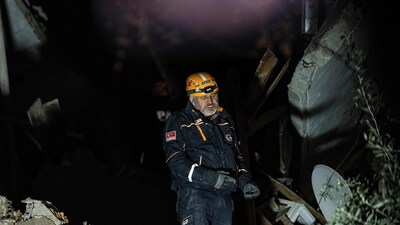 A rescue worker searches for victims at a collapsed building after a 6,4-magnitude second earthquake hit the Hatay province in southern Turkey, in Antakya, on February 20. (AFP)