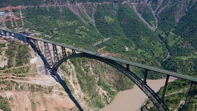 The track laying work started on the Chenab railway bridge, located 359 metres above the riverbed, in Reasi district of Jammu and Kashmir on Tuesday. (HT Photo) The track laying work started on the Chenab railway bridge, located 359 metres above the riverbed, in Reasi district of Jammu and Kashmir on Tuesday. (HT Photo)