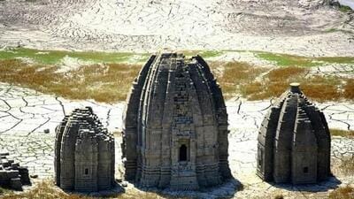 These structures are what is left of the 28 temples of old Bilaspur, built between the sixth and 17th centuries, that got submerged in the Gobind Sagar Lake when the Bhakra-Nangal dam was built. When the water level recedes in summer, the edifices stand tall on the bare sandy lake bed and disappear under water in monsoon. (HT file photo) These structures are what is left of the 28 temples of old Bilaspur, built between the sixth and 17th centuries, that got submerged in the Gobind Sagar Lake when the Bhakra-Nangal dam was built. When the water level recedes in summer, the edifices stand tall on the bare sandy lake bed and disappear under water in monsoon. (HT file photo)
