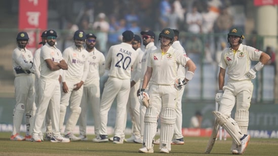 Australia's Marnus Labuschagne, right, and Steve Smith, second right, wait for the third umpire's decision (AP)