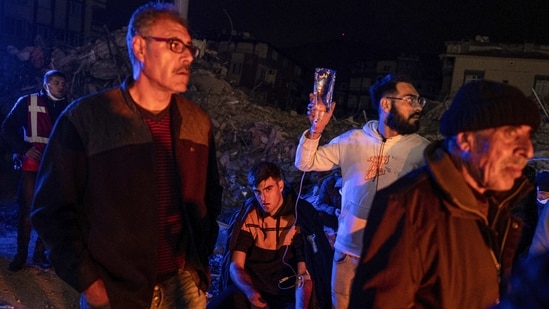 A man gets medical assistance after being injured in the latest earthquake in Hatay, Turkey.(AP)