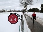 Pedestrians walk along the the Rideau Canal in Ottawa, Canada. This winter has brought wild and unseasonably warm weather to Canada's capital, raising the prospect that its Rideau Canal skateway -- the longest in the world -- will not open this season for the first time, due to a lack of ice. According to Environment Canada, Ottawa is in the grips of its third-warmest winter ever recorded, with temperatures hovering just below freezing through most of December and January. 