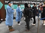 Covid In South Korea: Health workers guide travellers arriving from China. Covid In South Korea: Health workers guide travellers arriving from China.