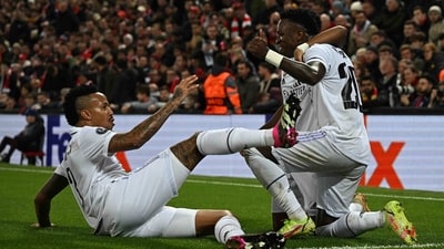 Real Madrid's Brazilian forward Vinicius Junior (R) celebrates scoring the team's second goal with Rodrygo (C) and Eder Militao during the UEFA Champions League mattch against Liverpool (AFP) Real Madrid's Brazilian forward Vinicius Junior (R) celebrates scoring the team's second goal with Rodrygo (C) and Eder Militao during the UEFA Champions League mattch against Liverpool (AFP)