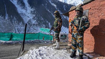 Security personnel stand guard near the Srinagar-Leh national highway, the lifeline between the Kashmir Valley and Ladakh, at Zojila in Ganderbal district of Central Kashmir, India. (PTI) Security personnel stand guard near the Srinagar-Leh national highway, the lifeline between the Kashmir Valley and Ladakh, at Zojila in Ganderbal district of Central Kashmir, India. (PTI)