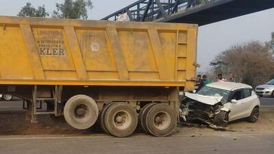 The car rammed into a stationary truck parked outside an auto agency on the national highway near Khanna in Ludhiana. (HT Photo)