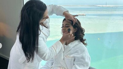 Ananya getting her makeup done in a bathrobe. Ananya getting her makeup done in a bathrobe. 