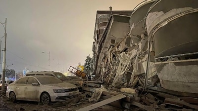 Damaged vehicles seen parked in front of a collapsed building following the devastating earthquake in Turkey. (AP/ Representational image) Damaged vehicles seen parked in front of a collapsed building following the devastating earthquake in Turkey. (AP/ Representational image)