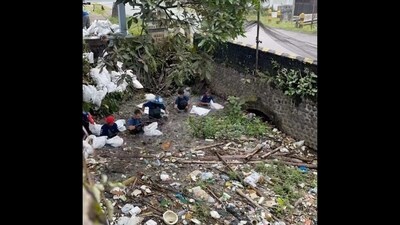 Men cleaning the water body in Indonesia. (Instagram/@garybencheghib) Men cleaning the water body in Indonesia. (Instagram/@garybencheghib)