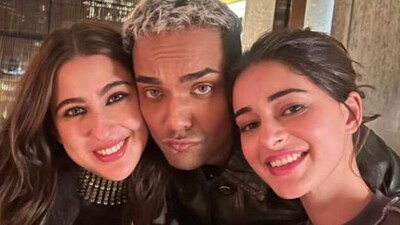 Sara Ali Khan and Ananya Panday with their hair stylist, posing for a photo at dinner. Sara Ali Khan and Ananya Panday with their hair stylist, posing for a photo at dinner.