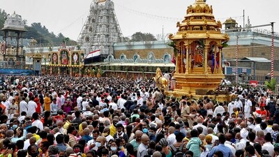 Devotees take part in the golden chariot procession of the Lord Venkateswara temple on the occasion of Vaikuntha Ekadasi, at Tirumala in Tirupati. (File/PTI) Devotees take part in the golden chariot procession of the Lord Venkateswara temple on the occasion of Vaikuntha Ekadasi, at Tirumala in Tirupati. (File/PTI)